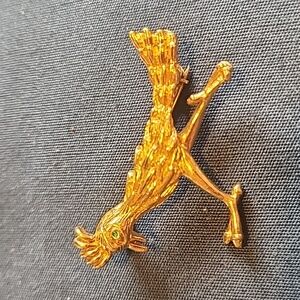 Roadrunner gold tones green rhinestone eye brooch